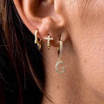 cross huggie earring