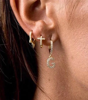 cross huggie earring